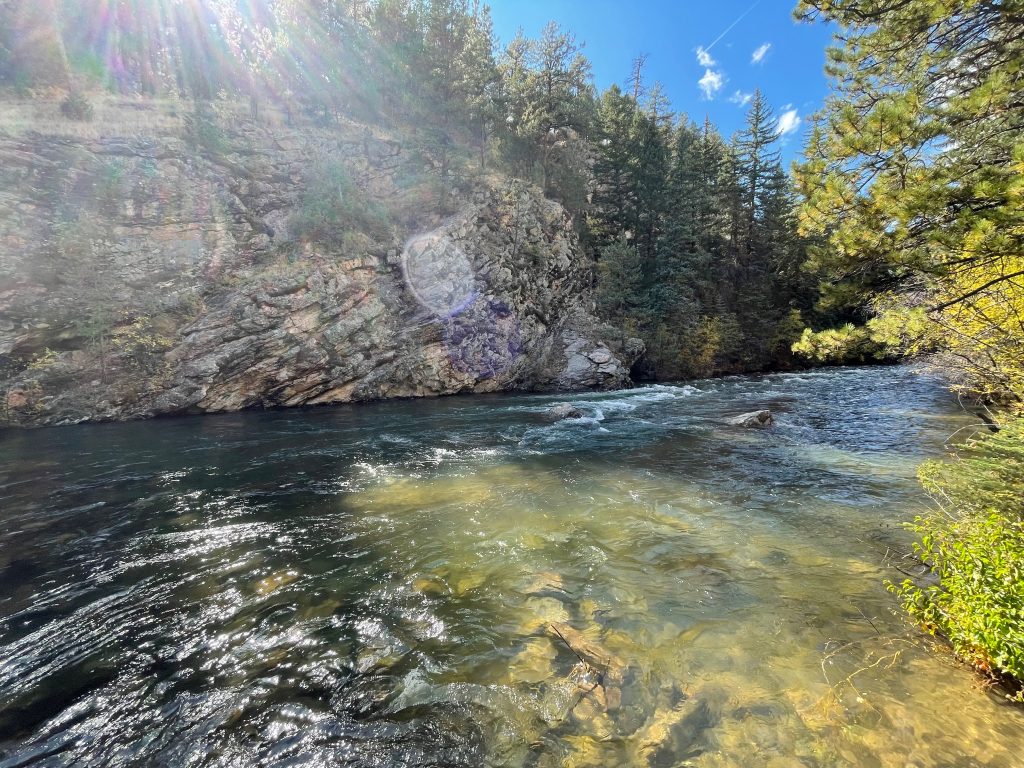 Reading water when it is deep and fast with surrounding cliffs and trees