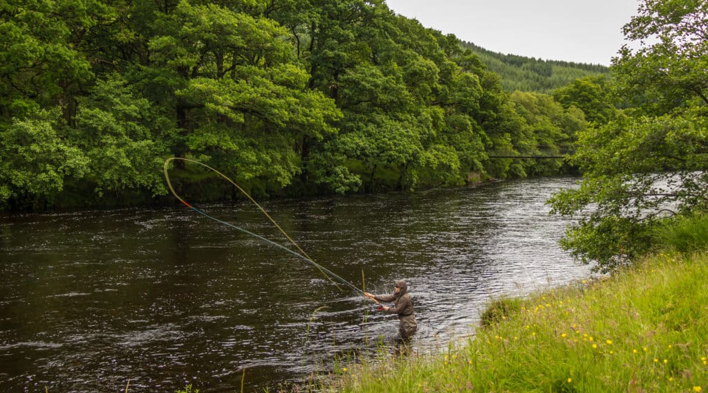 An angler fly fishing on the River