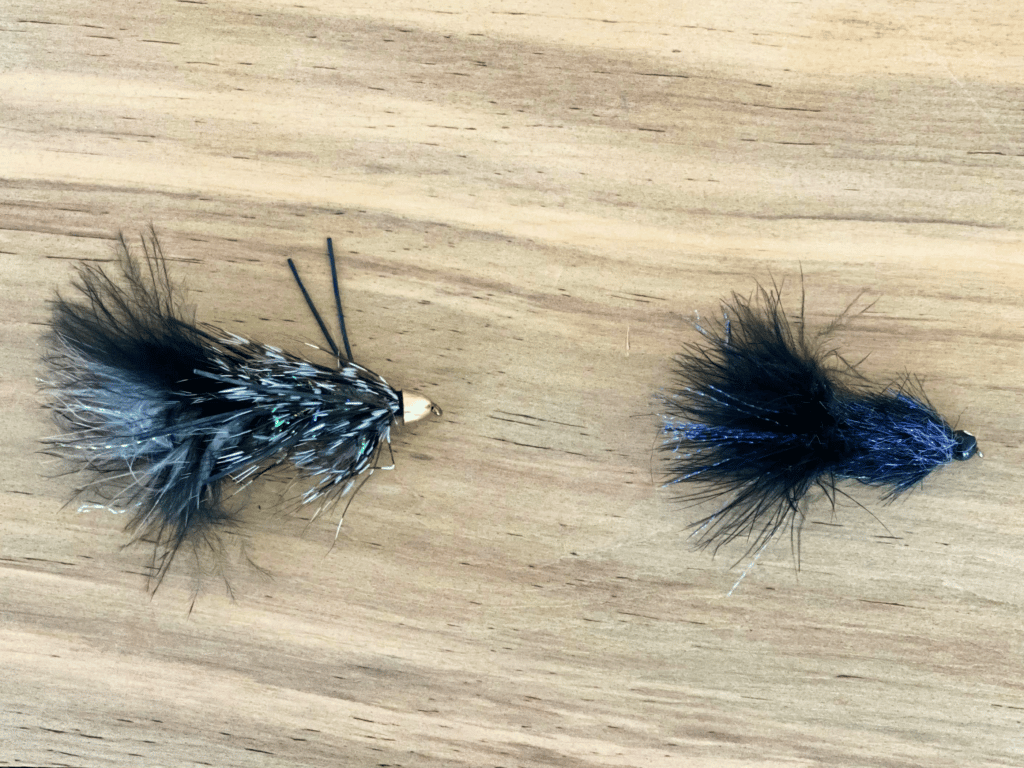 Two dark-colored streamers to be tied on the same line